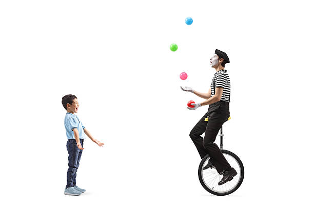 istock Asian boy watching a mime juggling 2206337695