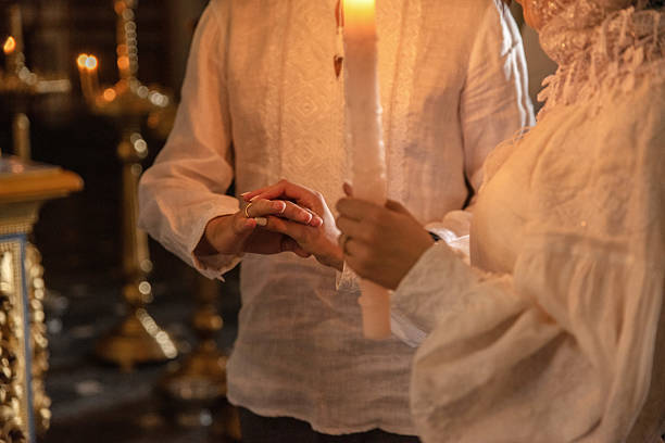 istock A couple exchange rings during a traditional wedding ceremony 2206339325