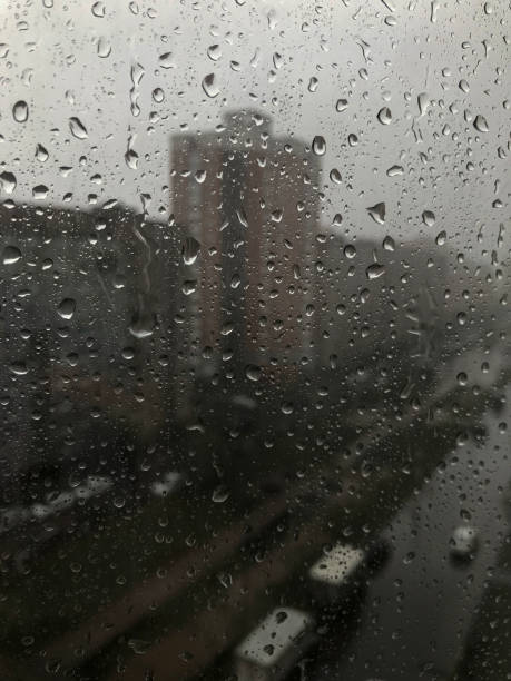 istock Rainy view of the city through the windows 2206339467