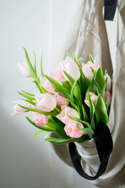 istock Pink tulips bouquet in shopper bag 2206340368