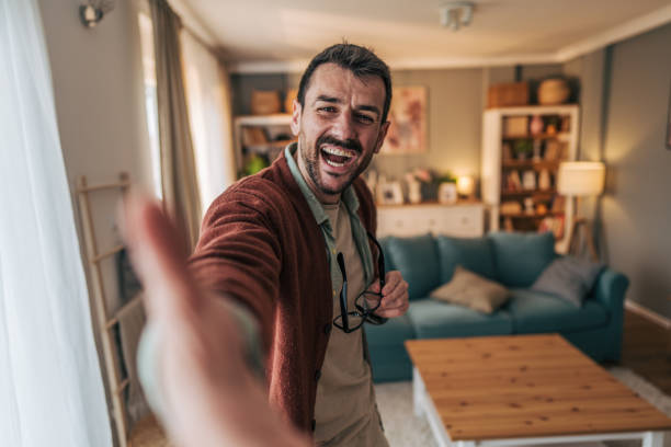 istock Cheerful man making a video call from home 2206340464
