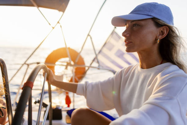 istock Woman skipper on a sailboat 2206341374