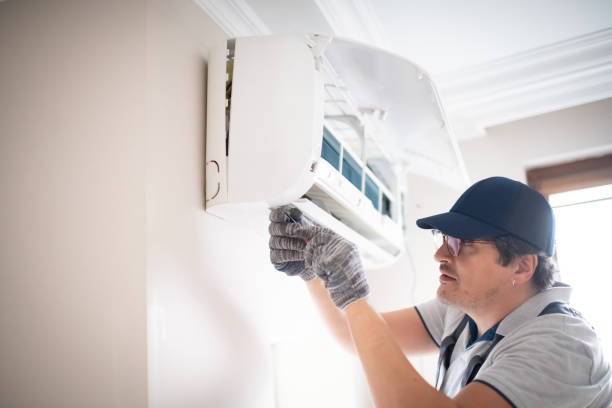 istock Technician with screwdriver repairing air conditioner at home 2206342643