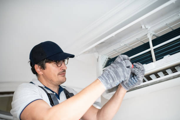 istock Technician with screwdriver repairing air conditioner at home 2206342651