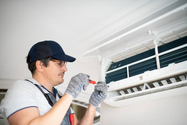 istock Technician with screwdriver repairing air conditioner at home 2206342686