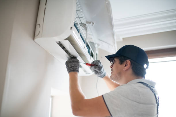 istock Technician with screwdriver repairing air conditioner at home 2206342687