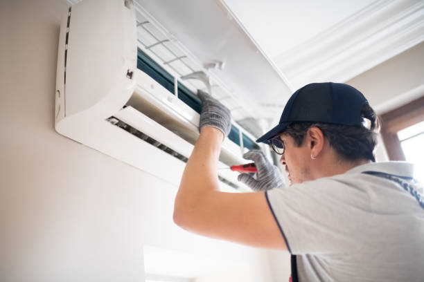 istock Technician with screwdriver repairing air conditioner at home 2206342705