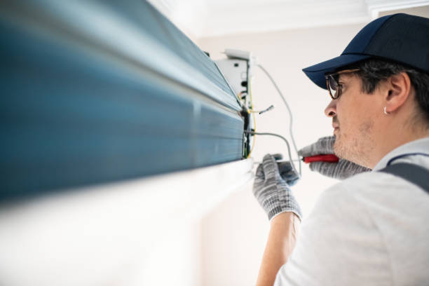 istock Technician with screwdriver repairing air conditioner at home 2206342797