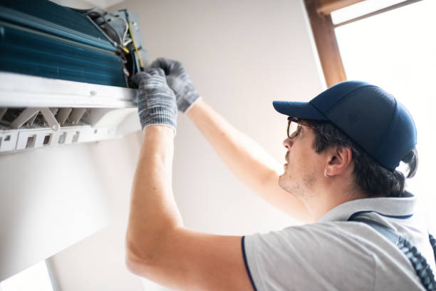 istock Technician repairing air conditioner at home 2206342821