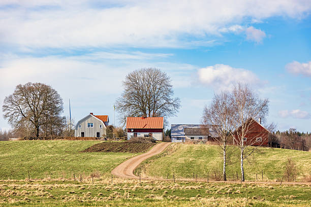 istock Farmstead on a hill in a rural spring landscape 2206345466