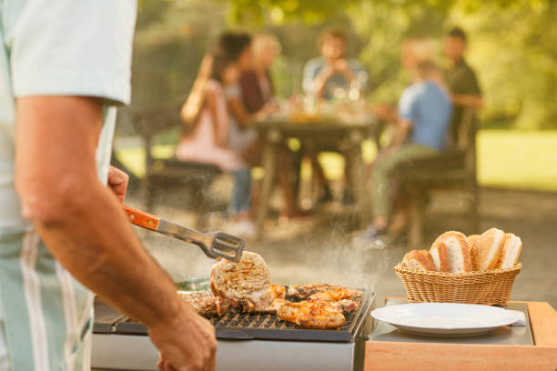 istock Grilling Meat for a Picnic Under the Summer Sun 2206346834