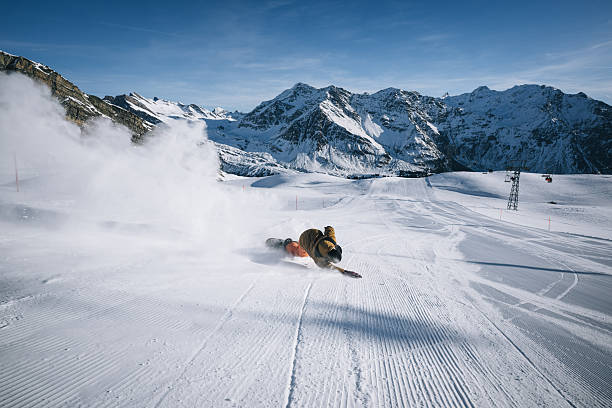 istock Snowboarder descends mountain at ski resort 2206351450