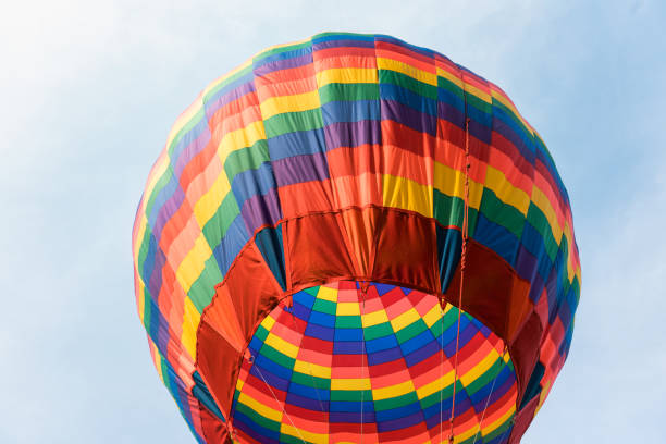 istock Colorful hot air balloon floating in blue sky 2206352061