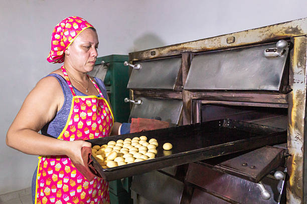 istock A hispanic woman baking Achira cakes 2206361667