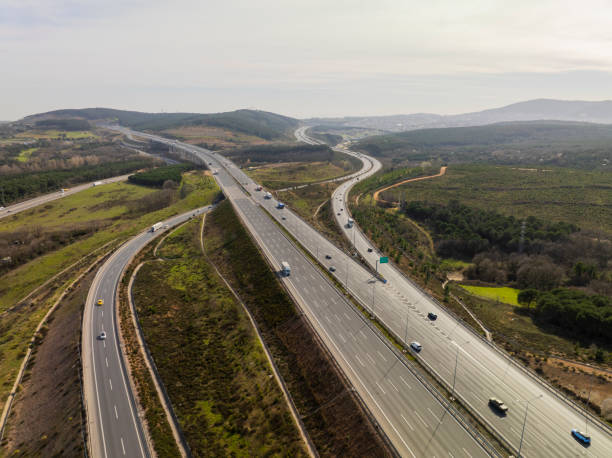 istock Aerial view of complex highway road junction with traffic moving 2206362535