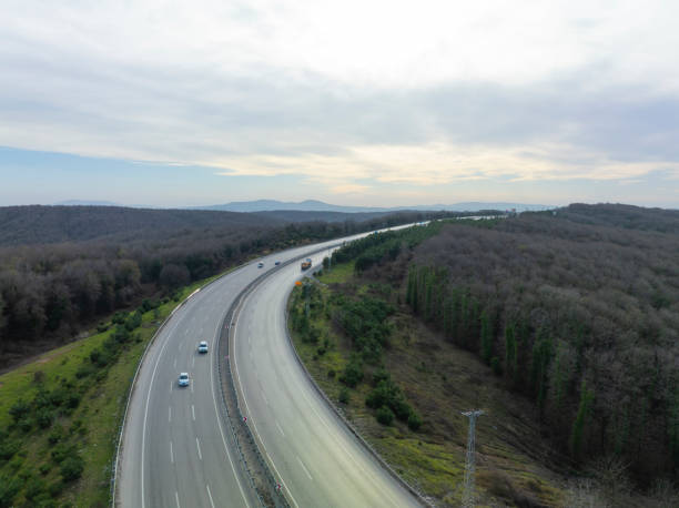 istock Aerial view of complex highway road junction with traffic moving 2206362543