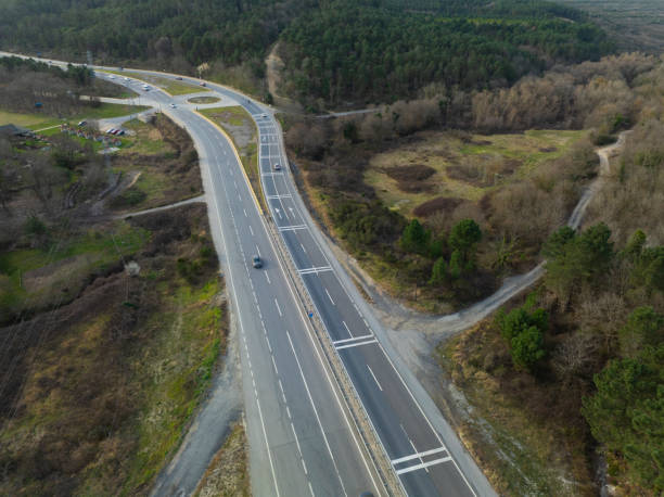 istock Aerial view of complex highway road junction with traffic moving 2206362554