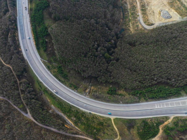 istock Aerial view of complex highway road junction with traffic moving 2206362563