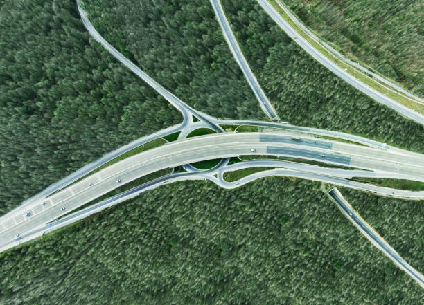 istock Aerial view of complex highway road junction with traffic moving 2206362904