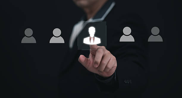 istock Recruitment people or Human Resource Management (HR) concept : Bussinessman using finger for choose human development recruitment leadership and customer target group to enter the position in company 2206367572