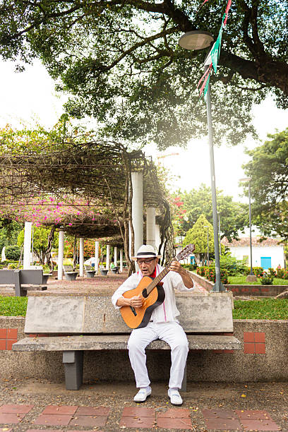istock A colombian guitarist singing on a chair 2206368900