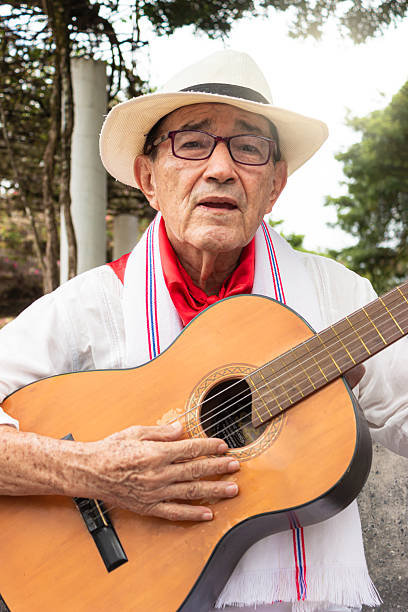 istock A colombian guitarist singing on a chair 2206368905
