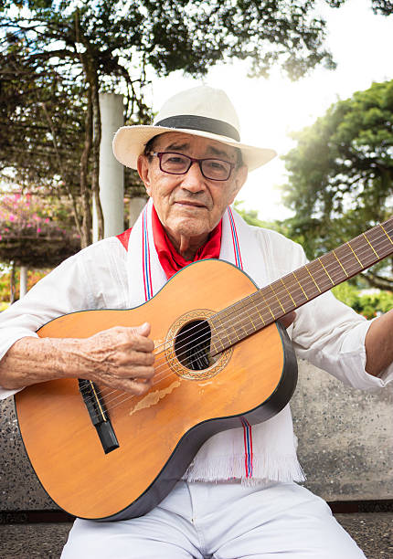 istock Colombian man playing guitar 2206368935