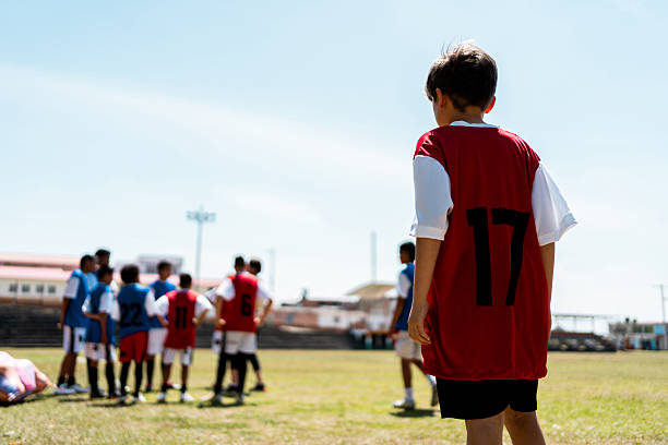 istock Child soccer player on a soccer field 2206372448