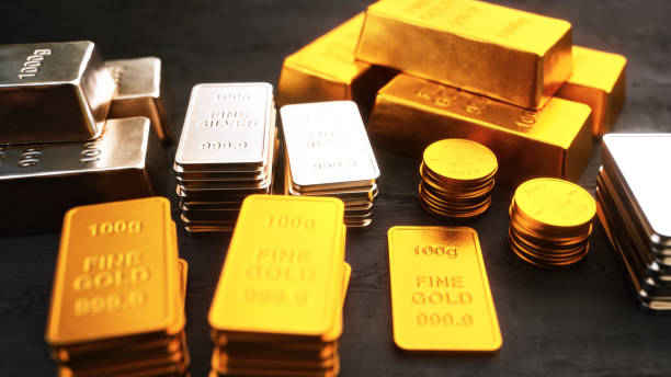 istock Stacks of gold and silver ingots and coins 2206373034