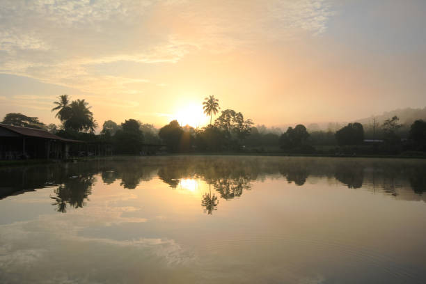 istock View of sunrise with reflection on a still lake. 2206373755