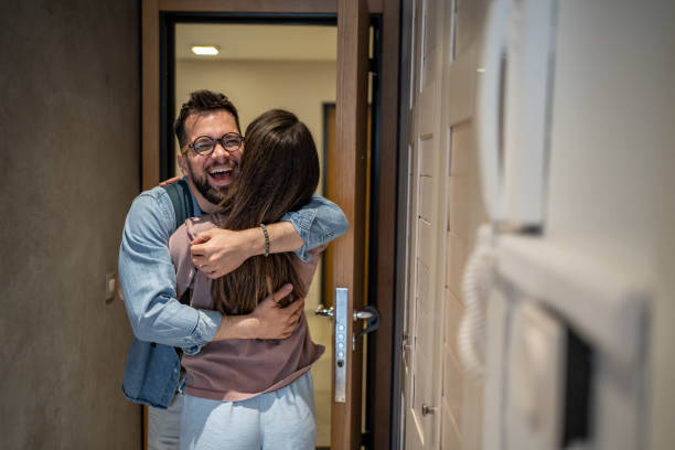 istock Happy couple embracing at home after long time 2206374321