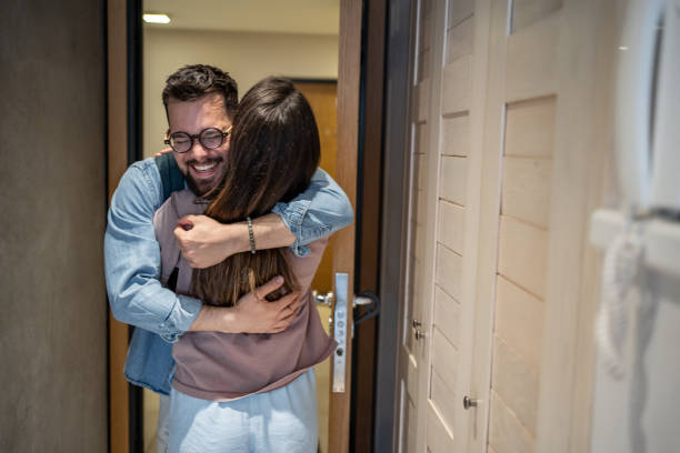 istock Happy couple embracing at home after long time 2206374324