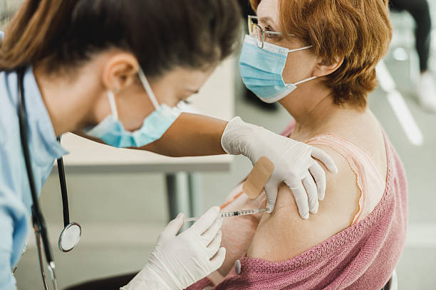 istock Senior Woman Getting Vaccinated Due To Covid-19 2206374327