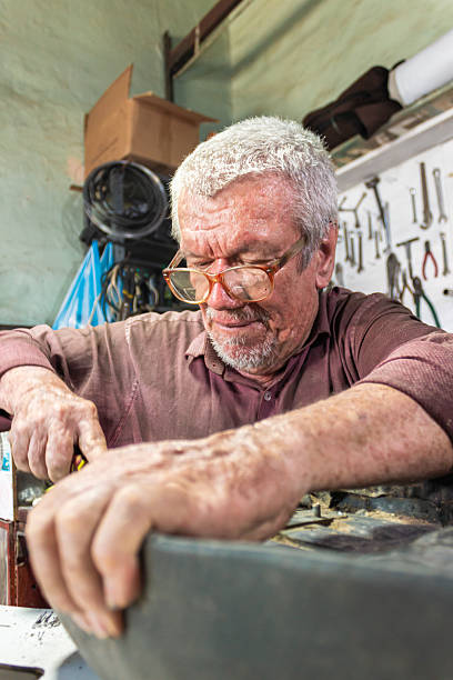 istock A latino man working with a screwdriver 2206376312