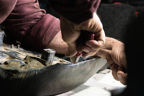 istock Hand of a person working with pliers 2206377507