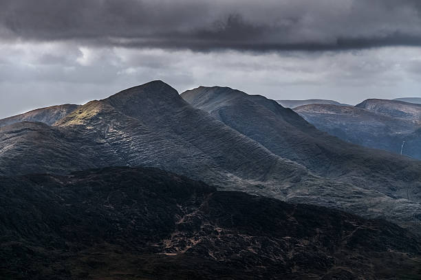 istock A remote region with dramatic mountain scenery and rugged terrain under an overcast sky. 2206378484