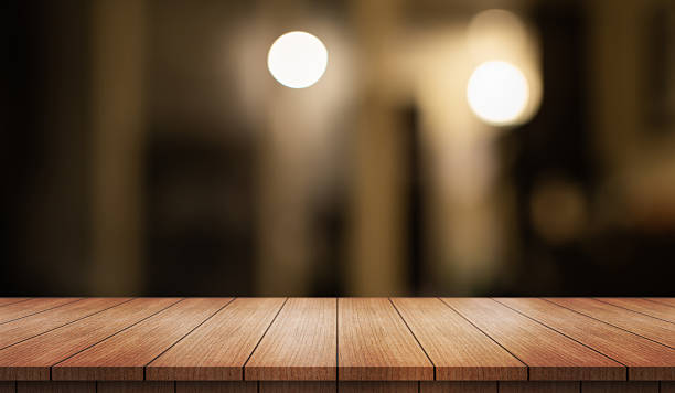 istock Empty wooden table top with lights bokeh on blur restaurant background. 2206381540