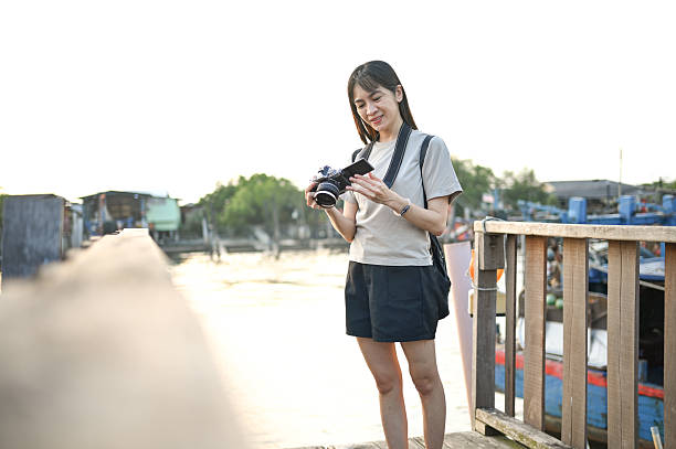 istock Moments Captured: A Solo Traveler on the Docks at Dusk 2206383697