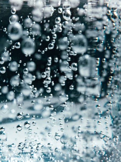 istock Abstract Blue water bubbles background. Bubbles underwater texture . Close-up soda water bubbles. Vertical background. 2206385099