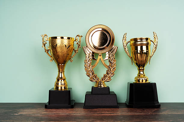 istock Standing golden trophy cups 2206391726