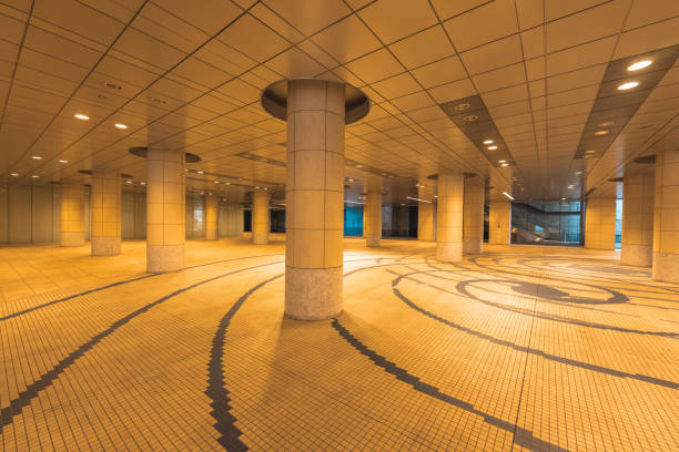 istock Empty covered passageway with columns and spiral floor pattern in tokyo, japan 2206391954