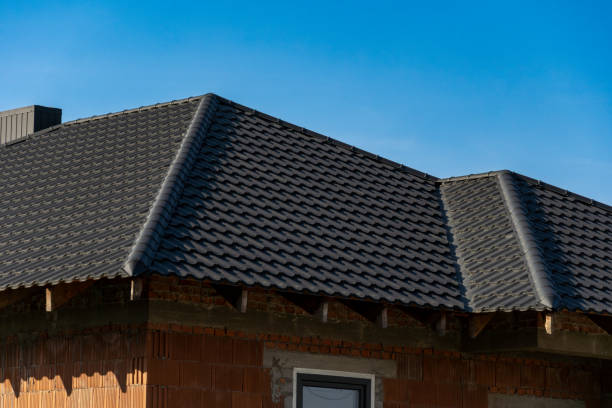 istock A newly installed slate roof rests atop a residential structure. The building features exposed brick walls with a simple design under clear skies 2206393257