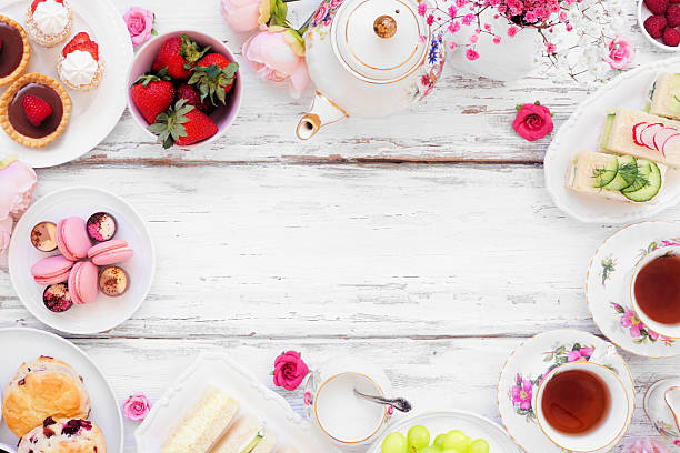 istock Afternoon tea frame against a white wood background 2206395226