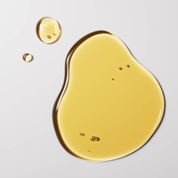 istock Hemp seed or Macadamia Oil drops puddle texture, 3d rendering honey minimalist background 2206397836