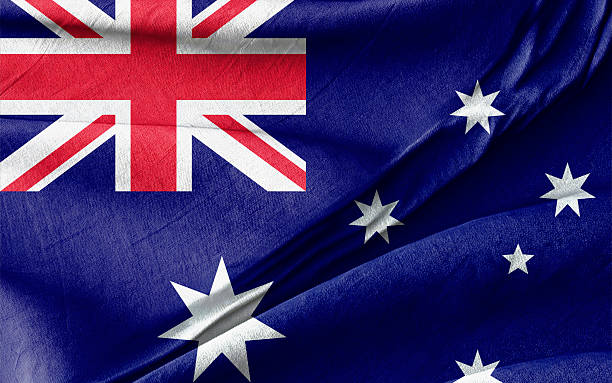 istock Australian Flag Displayed with a Close-Up on Wrinkled Blue Fabric Texture 2206399790