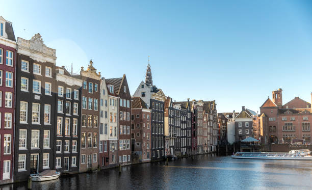 istock Amsterdam houses along the canal 2206400302
