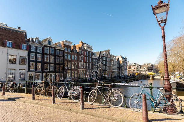 istock Amsterdam houses along the canal 2206401068