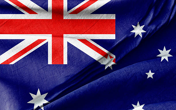istock Australian Flag Displayed with a Close-Up on Wrinkled Blue Fabric Texture 2206402663