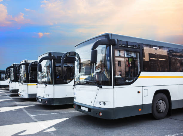 istock Buses lined up in a parking lot 2206404951