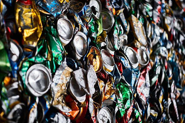 Pressed tin cans from drinks at recycling plant macro view. Process of rubbish materials reusing. Sustainable ways to produce items